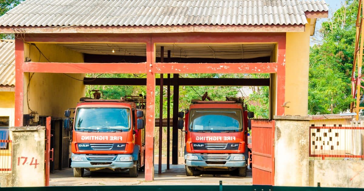 Trucks parked under a lorry park shelter in West Africa