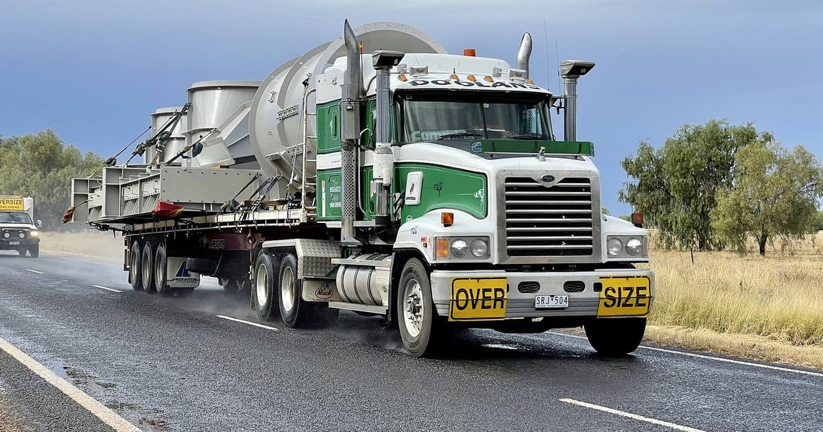Oversized load with its escort vehicle