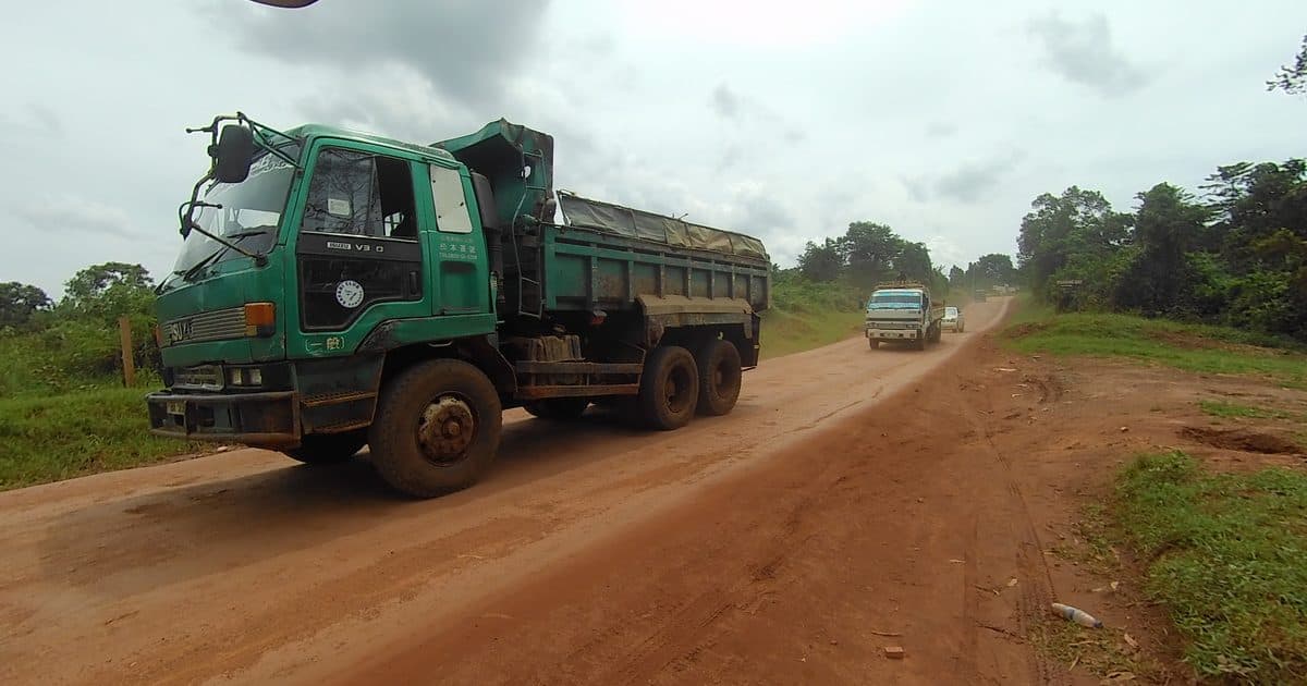 Loaded truck driving on a laterite track