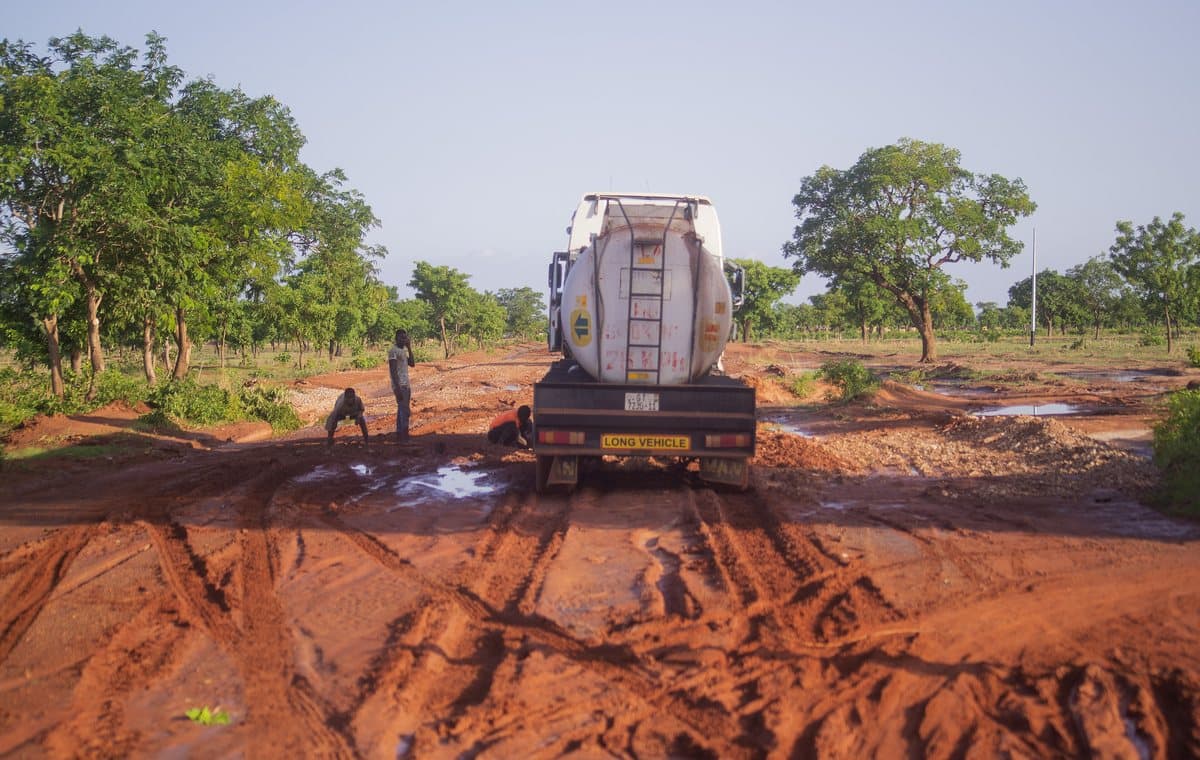 A fuel tanker on a waterlogged laterite road in Ghana