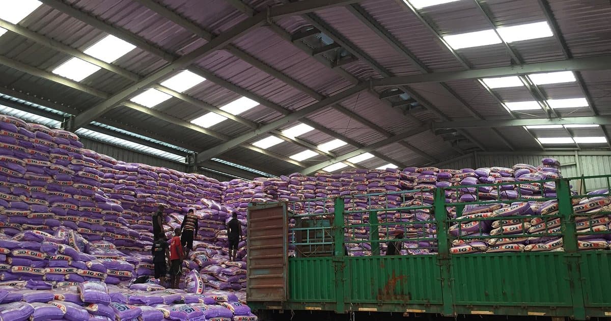 Bags of rice being unloaded from a truck into a warehouse in Dakar
